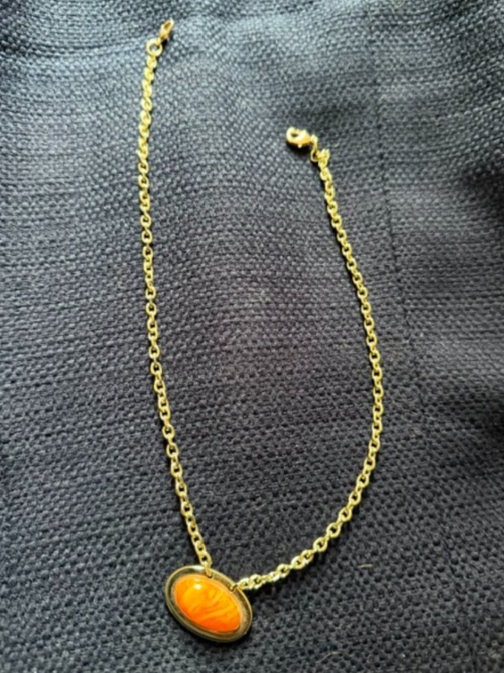Pendant Necklace with amber/gold-colored pendant